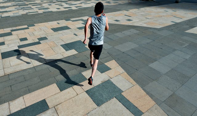 Man running in city street