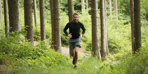 man running in forest