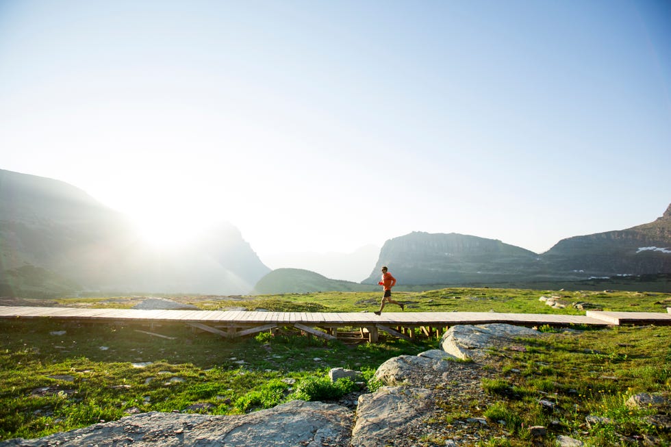 a man running in glacier park