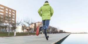 man running in public park in winter day alone