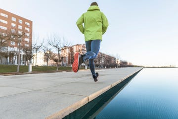 man running in public park in winter day alone