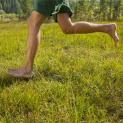 man running in the nature only lower extremities