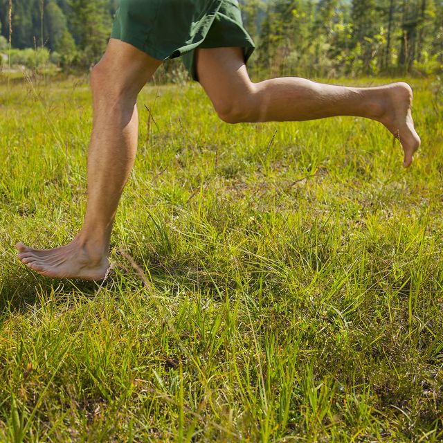 man running in the nature only lower extremities
