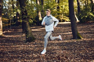 man running in woods