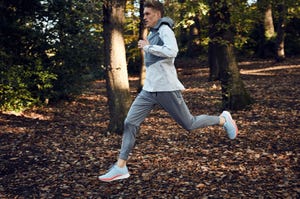 man running in woods