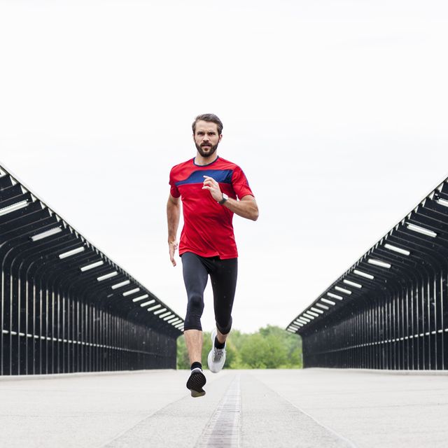 man running fast on a bridge