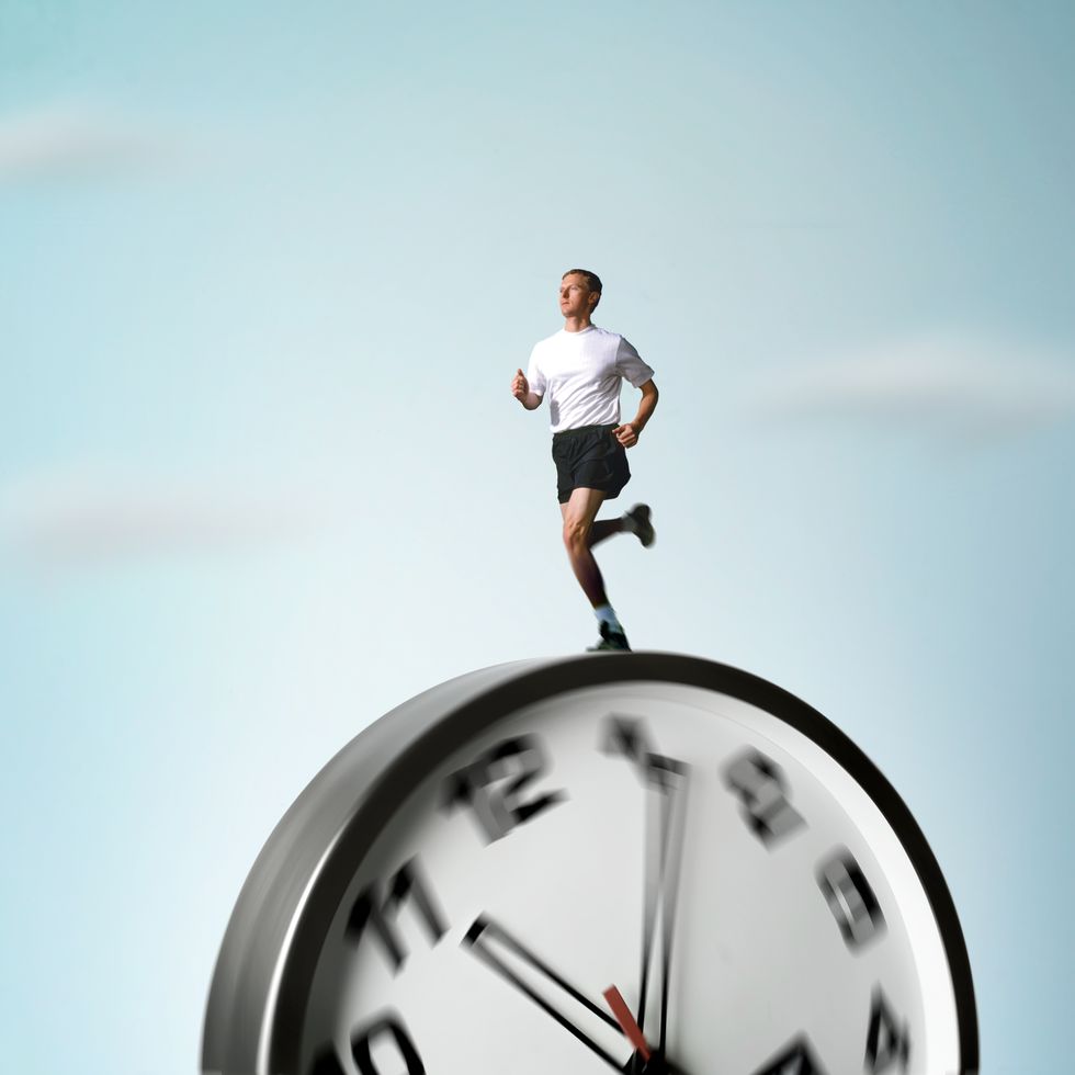 man running on rolling clock