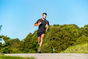 man running on rural path