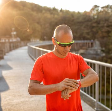 man running on the bridge in nature