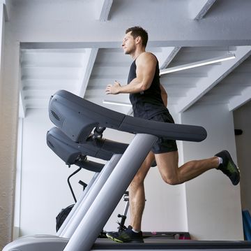 man enthusiasts running on treadmill at gym