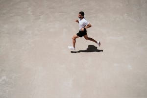 man running outdoors in sunshine