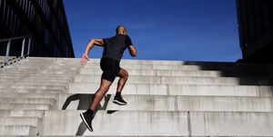 man running up outdoor stairs