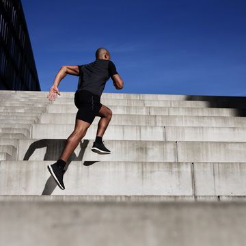 man running up outdoor stairs