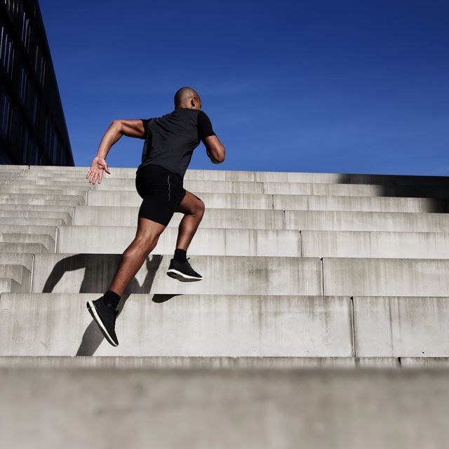 man running up outdoor stairs
