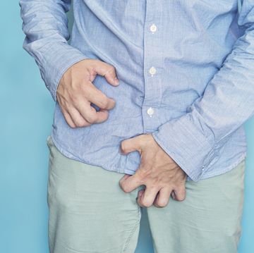man scratch the itch with hand, penis, itching, concept with healthcare and medicine urinary incontinence itching in the groin