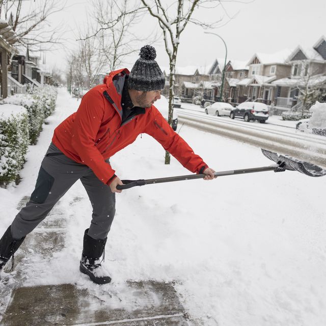 Man shoveling snow in winter
