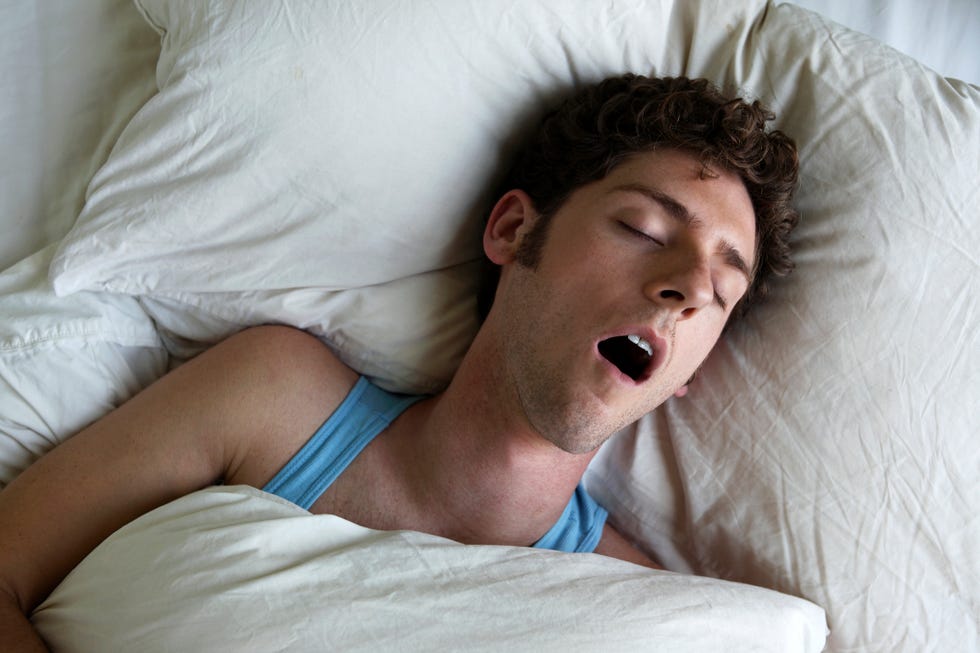 man sleeping and snoring, overhead view