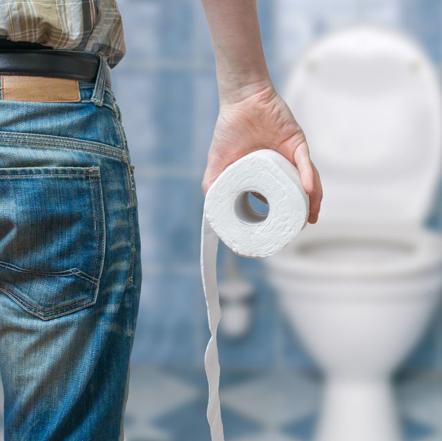 man suffers from diarrhea holds toilet paper roll