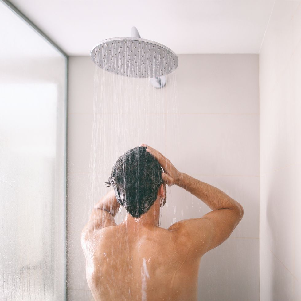 https://hips.hearstapps.com/hmg-prod/images/man-taking-a-shower-washing-hair-with-shampoo-royalty-free-image-1683066303.jpg?crop=0.66635xw:1xh;center,top&resize=980:*