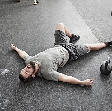 Man taking break in cross training gym