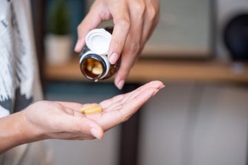 man taking vitamins and supplements