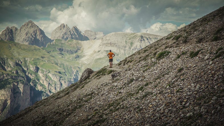 man trail running on mountain outdoors adventures on the dolomites
