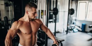 man training with dumbbells