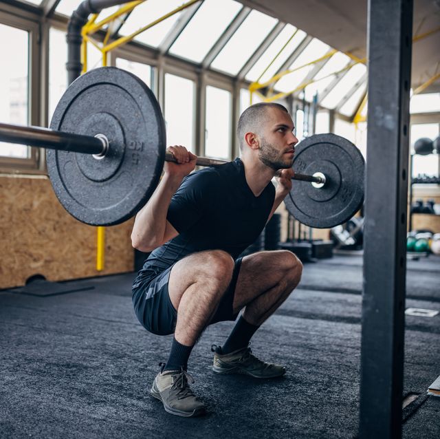 man training with weights
