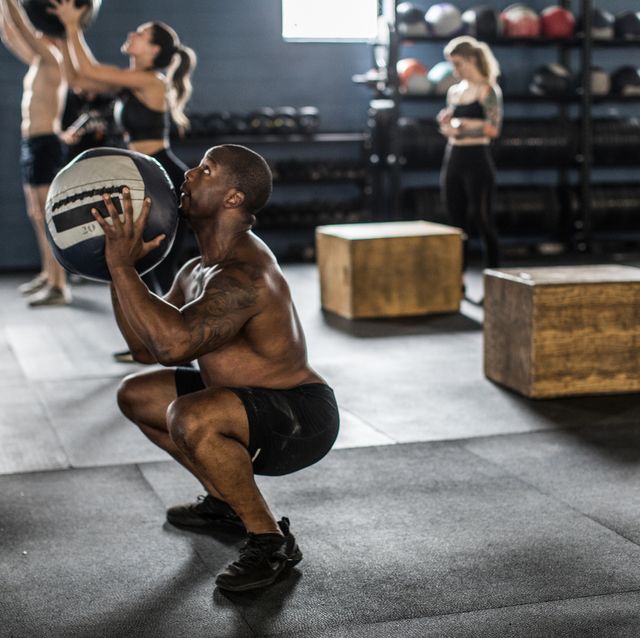 https://hips.hearstapps.com/hmg-prod/images/man-using-medicine-ball-at-cross-training-gym-royalty-free-image-1617118485.?crop=0.669xw:1.00xh;0.0505xw,0&resize=640:*