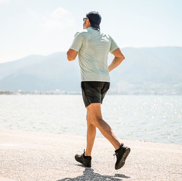 man walking and doing sports on the embankment