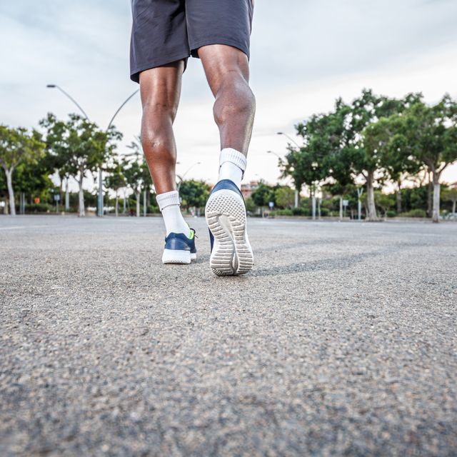 man walking down the street in sneakers healthy outdoor activity