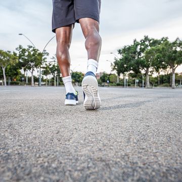 man walking down the street in sneakers healthy outdoor activity