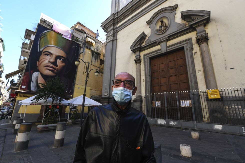 Man wearing a protective mask in the background Saint...