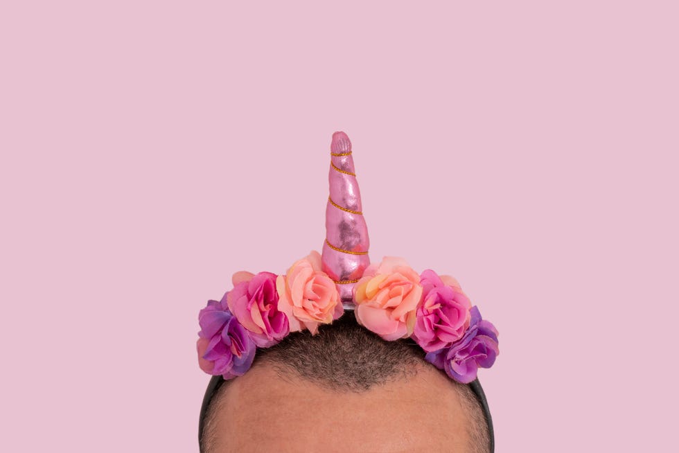 man wearing an unicorn headband