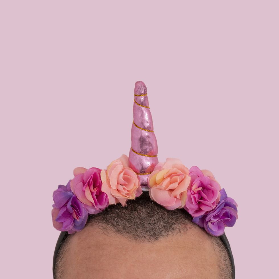 man wearing an unicorn headband
