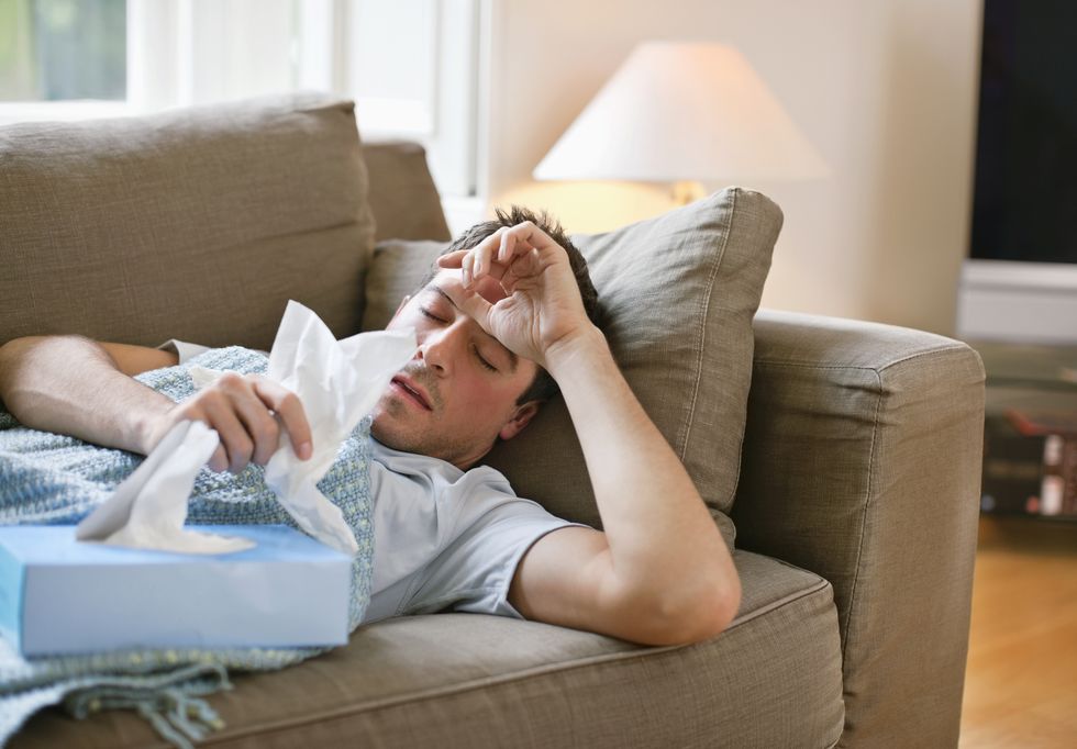 man with a frigid lying in sofa preserving tissues