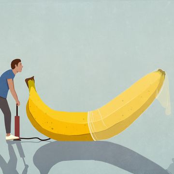 man with bicycle pump inflating condom on banana