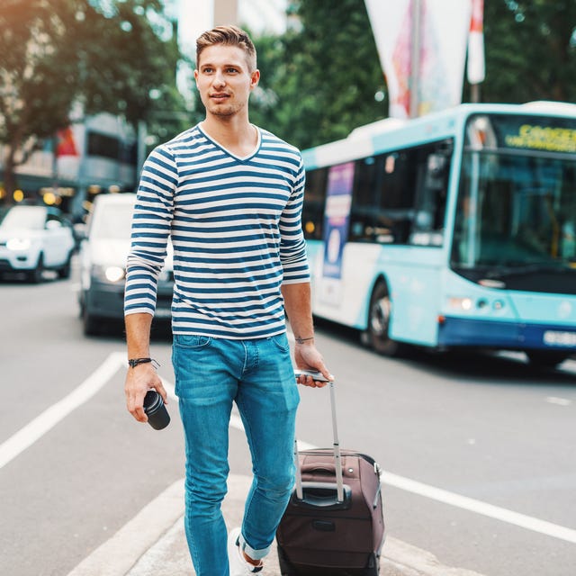Man with suitcase waiting for public transport man with suitcase waiting for public transport