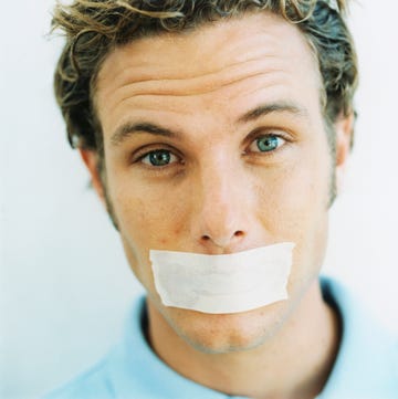 man with tape over mouth