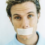 man with tape over mouth
