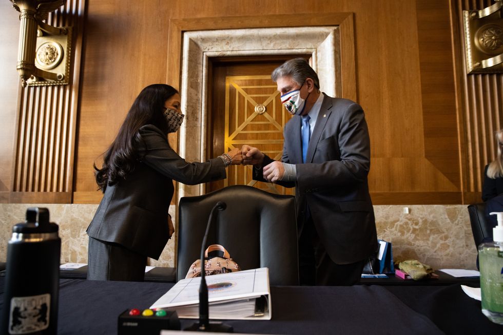washington, dc   february 23 rep deb haaland d nm, nominee for secretary of the interior, greets senator joe manchin d wv at her confirmation hearing before the senate committee on energy and natural resources on capitol hill february 23, 2021 in washington, dc if confirmed, haaland would become the first native american cabinet secretary in us history photo by graeme jennings poolgetty images