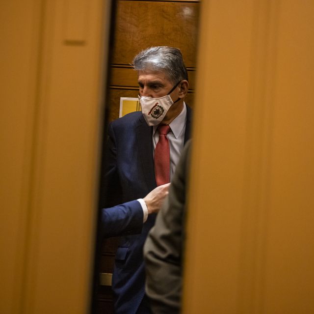 washington, dc   october 26 sen joe manchin d wv gets on an elevator in the basement of the us capitol building as he heads to the democratic policy luncheon on october 26, 2021 in washington, dc sen manchin has become a key player, and road block, in the democratic party when it comes to getting the major parts of president joe biden’s legislative agenda through congress photo by samuel corumgetty images  local caption  joe manchin