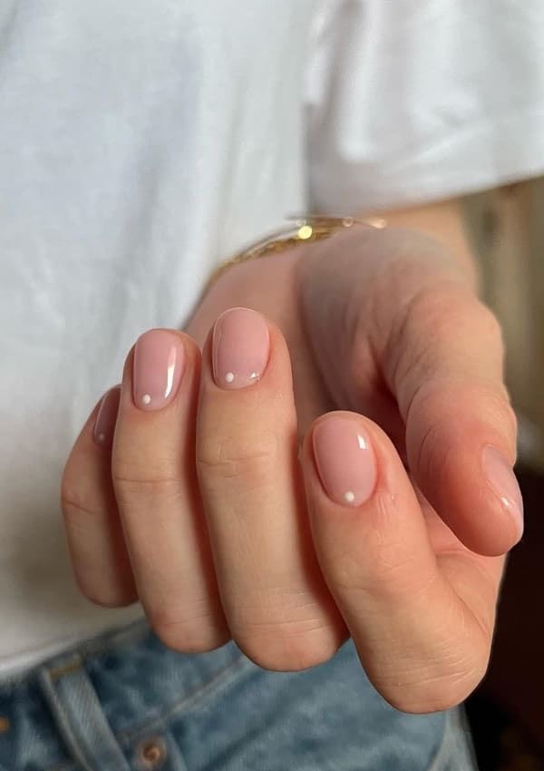 Neutral manicure with small drawings