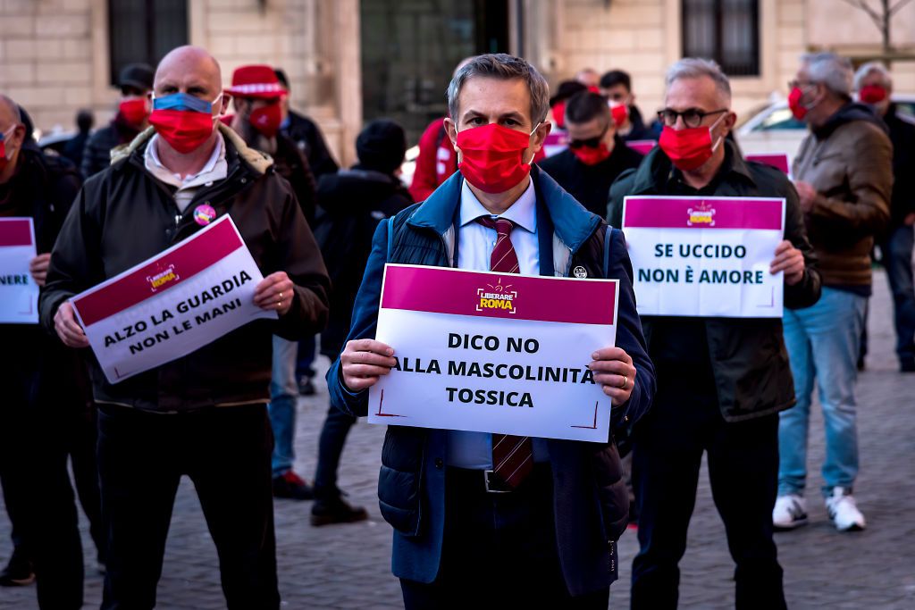 rome, italy   march 04 men take part in a flash mob to demonstrate against male violence against women wearing a red mask on march 4, 2021 in rome, italy men from liberare roma protested against the increase of violence against women since the pandemic and successive lockdowns, wearing red masks manufactured by women at the eva cooperative, which helps them build a path to autonomy after managing to escape violence photo by stefano montesi   corbiscorbis via getty images