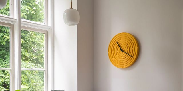 ‘minos’ wall clock by manon novelli in ‘freesia yellow’ raawii