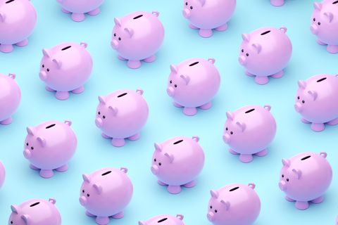many cute piggy banks on blue background