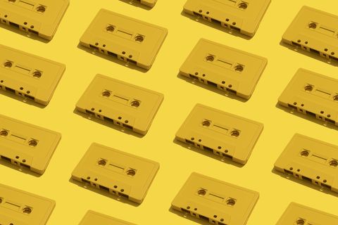 many yellow cassette tapes on yellow background