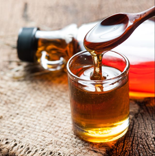 maple syrup in glass bottle on wooden table