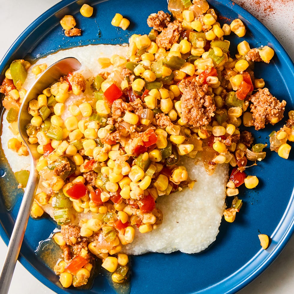 maque choux with sausage served over grits