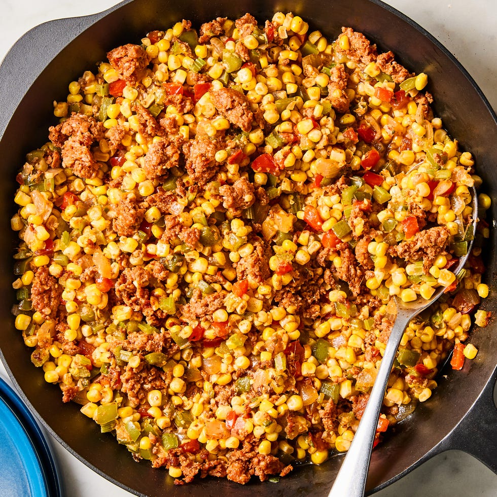 sausage, corn, and peppers in a skillet